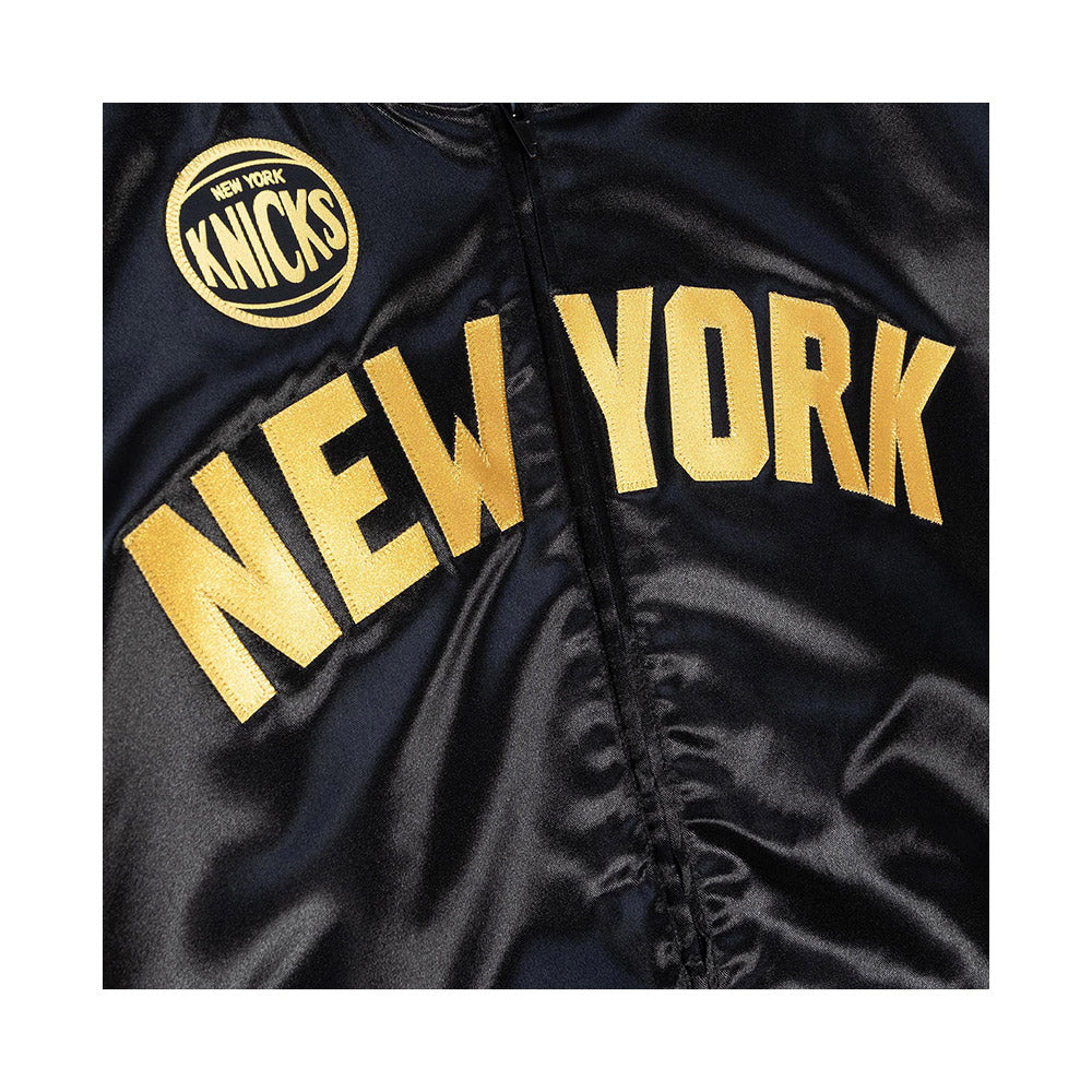 Mitchell & Ness Knicks Big Face 4.0 Satin Jacket In Black & Gold - Zoom View On Jacket Front Graphic