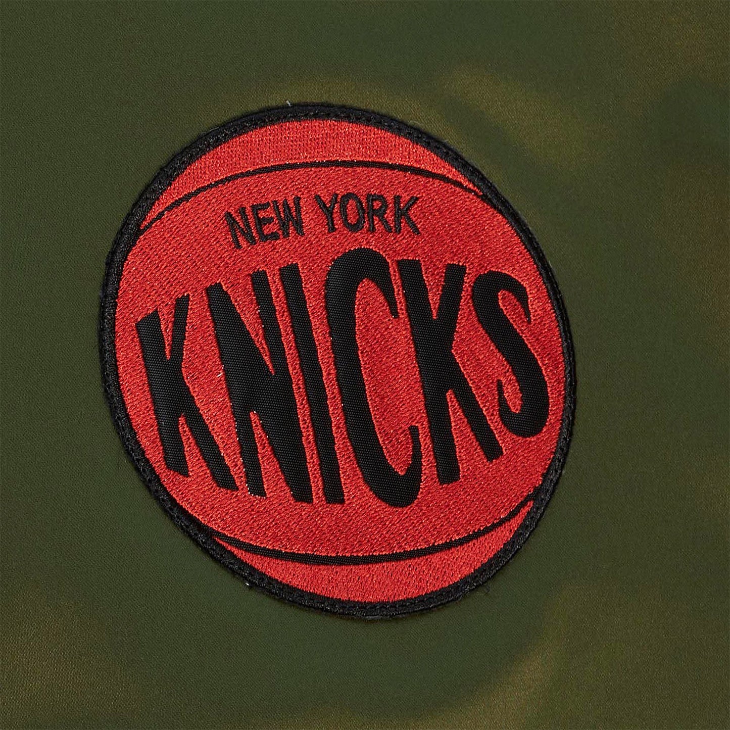 Mitchell & Ness Knicks Flight Satin Bomber Jacket In Green - Zoom View On Left Upper Chest Graphic