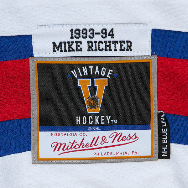 Mitchell & Ness Rangers Mike Richter 1993 Home Jersey In Blue - Zoom View On Left Hip Graphic